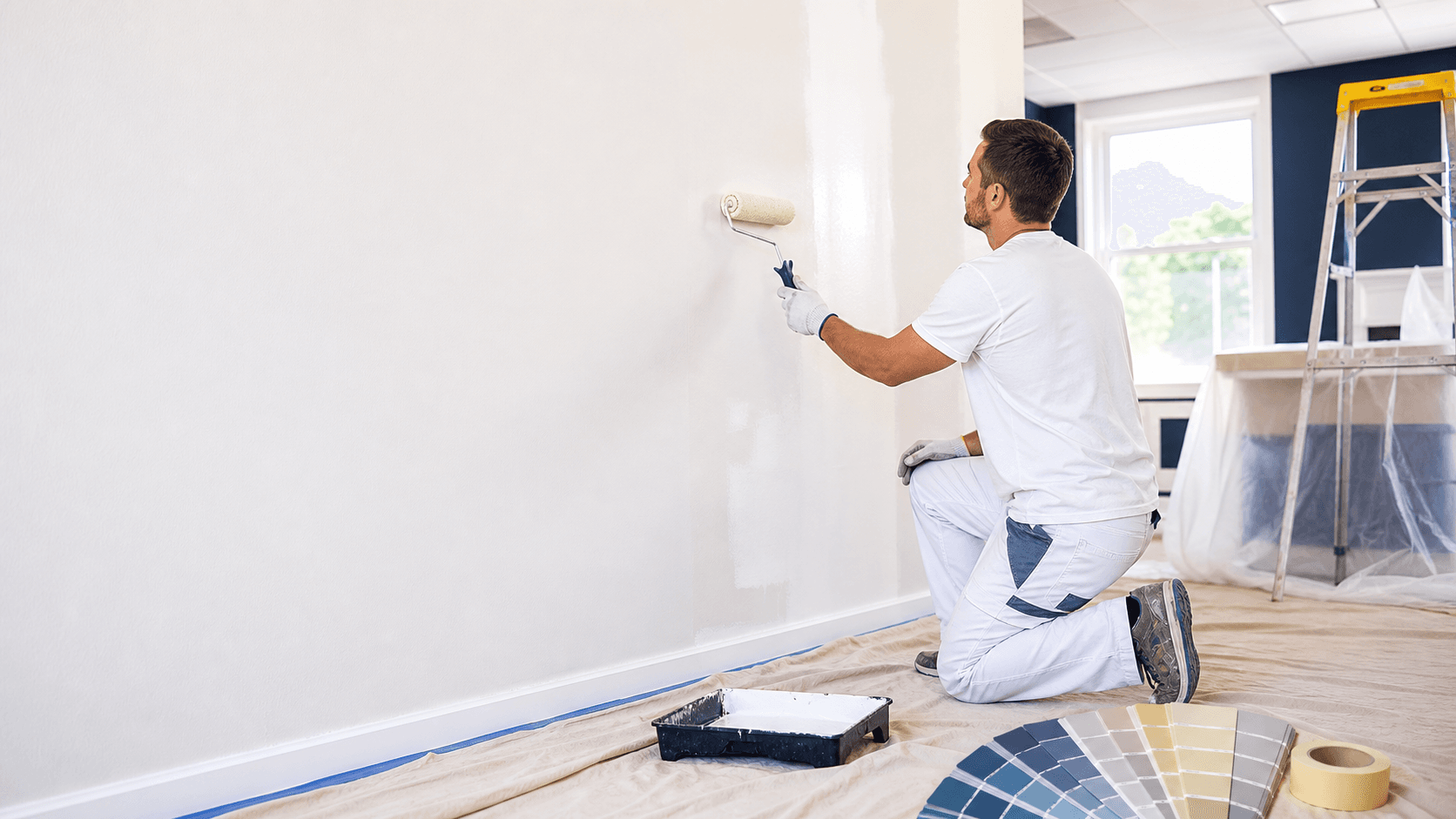 Professional painter working on a home exterior in Idaho Falls